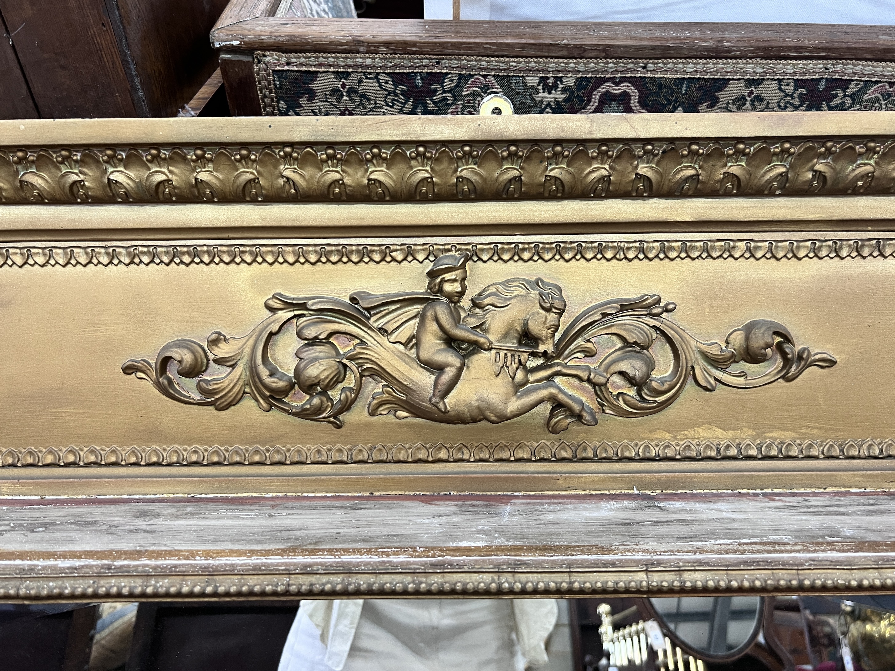 A late Victorian giltwood and composition triple plate overmantel mirror, width 144cm, height 85cm